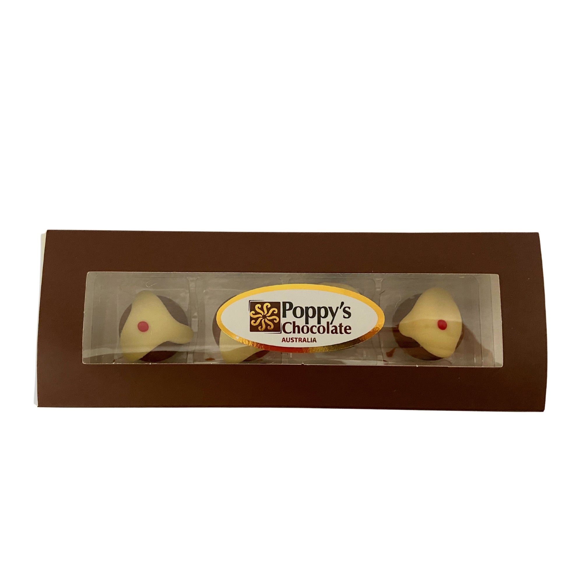 A rectangular box, labeled Poppy's Chocolate from Australia, contains four Christmas bell-shaped truffles featuring a white coating with red accents. These gluten-free chocolates boast a milk chocolate ganache center. The box is brown and includes a clear window section for display.